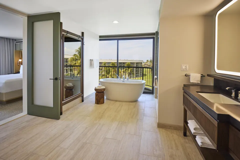 Makai One Bedroom Suite bathroom with soaking tub at Hilton Waikoloa Village