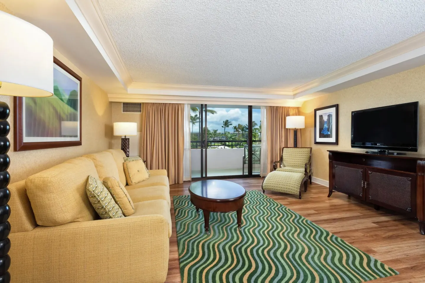 Makai One Bedroom Suite living room with balcony at Hilton Waikoloa Village