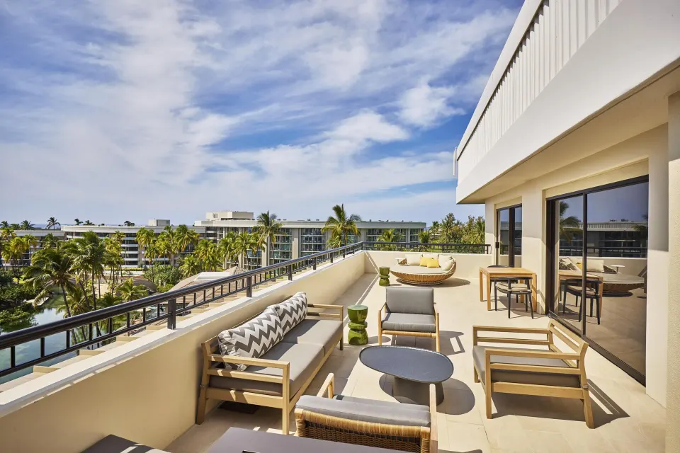 Palace One Bedroom Suite ocean-view terrace seating at Hilton Waikoloa Village.