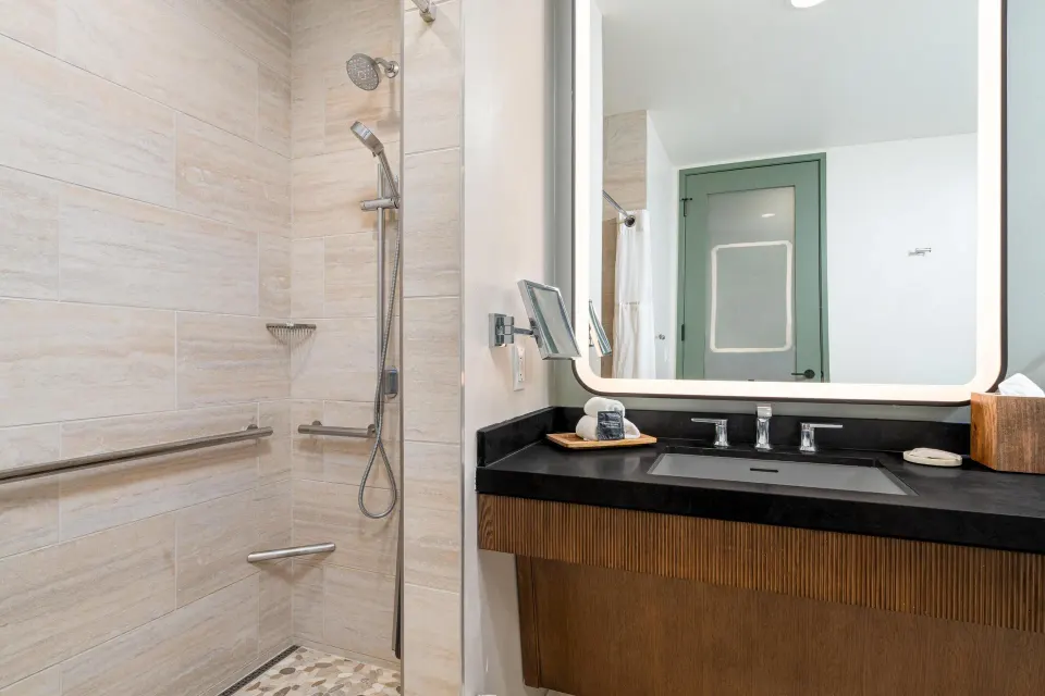 Roll-in shower and vanity in the Palace Presidential Suite at Hilton Waikoloa Village.