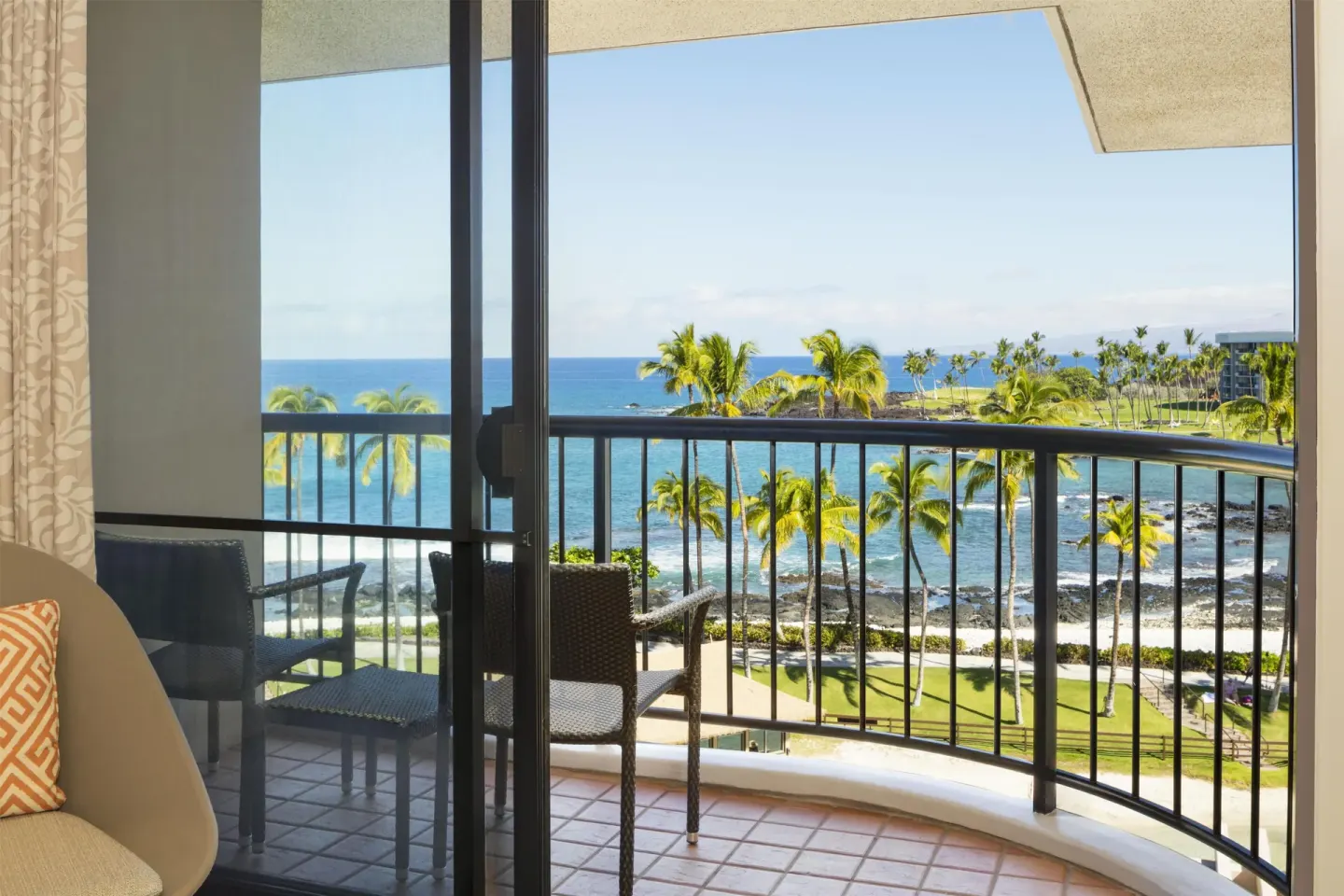 Ocean-view balcony seating in the Presidential Suite at Hilton Waikoloa Village.