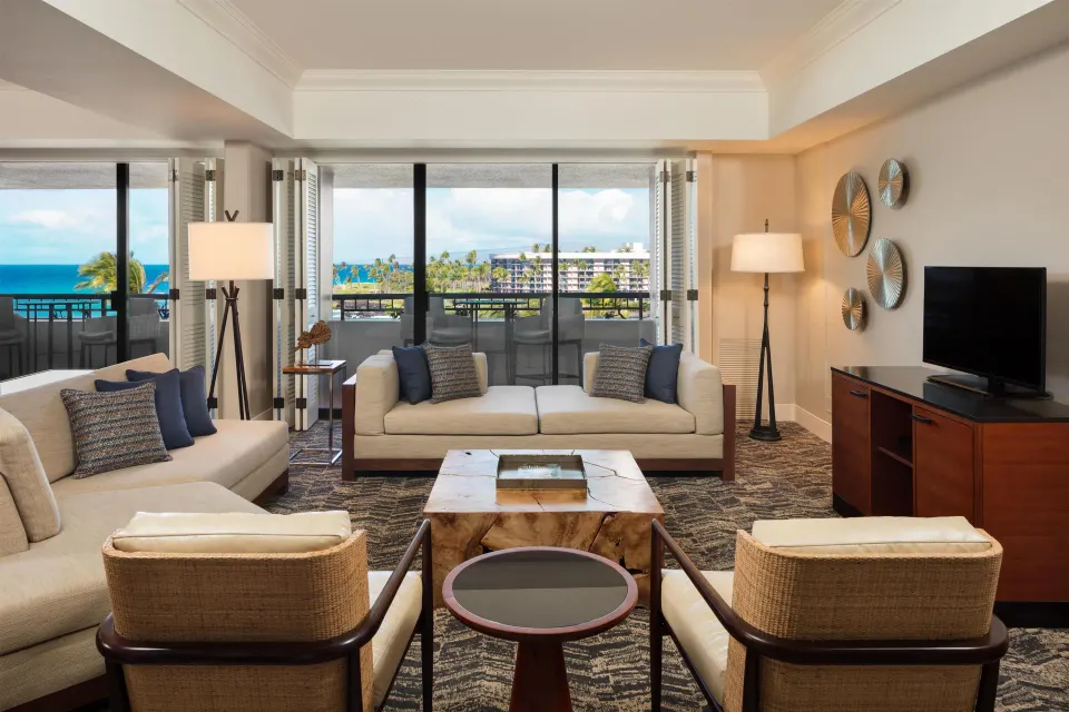 Presidential Suite living room with ocean-view balcony at Hilton Waikoloa Village.