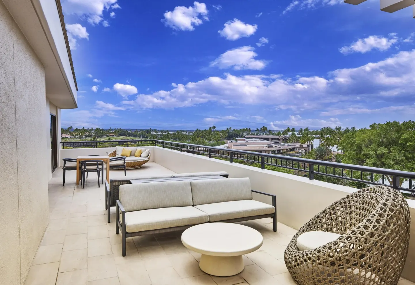Presidential Suite terrace seating and resort views at Hilton Waikoloa Village.