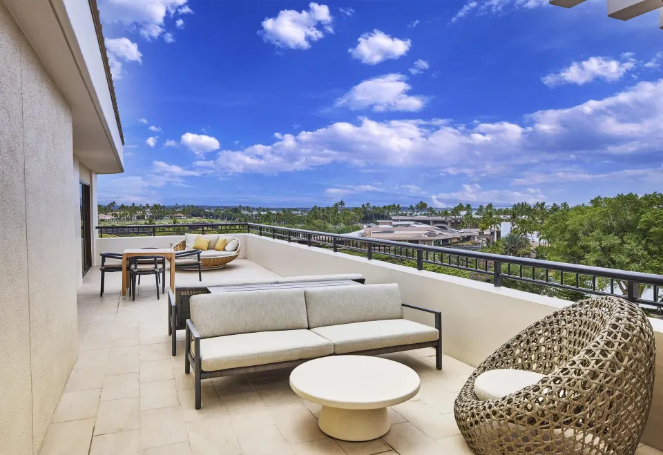 Presidential Suite terrace seating and resort views at Hilton Waikoloa Village.