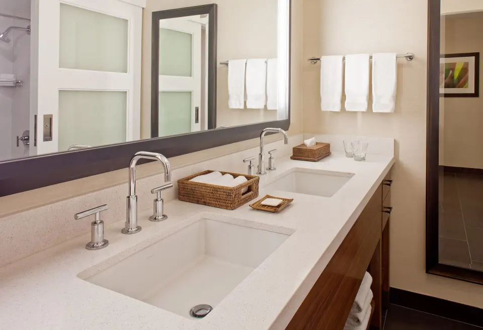 Resort View room bathroom vanity with double sinks at Hilton Waikoloa Village.