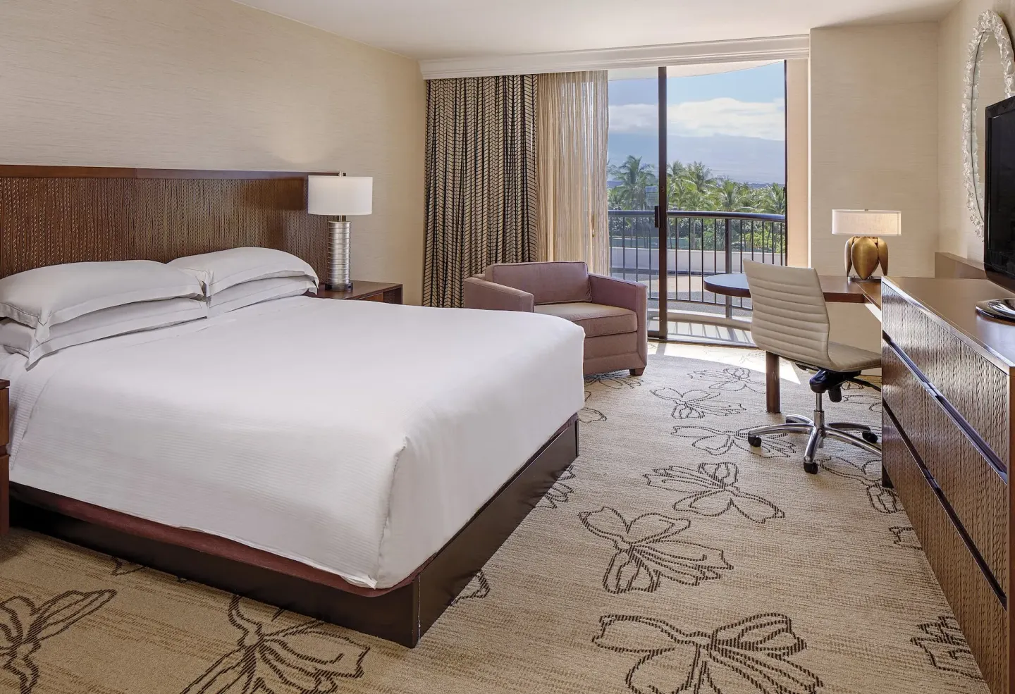 Resort View king guest room with balcony at Hilton Waikoloa Village.