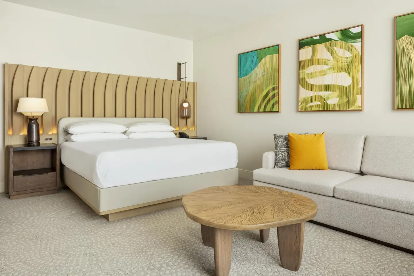 Renovated ocean view guest room with king bed and sofa bed at Hilton Waikoloa Village.