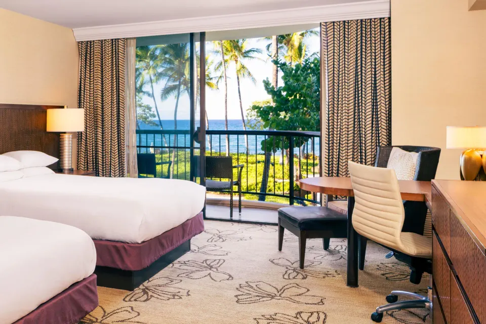 Accessible Makai ocean view room with two beds and balcony at Hilton Waikoloa Village.