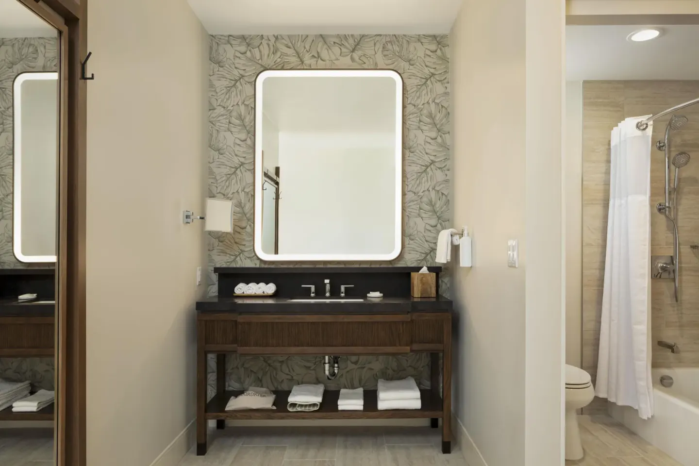 Accessible bathroom vanity and bathtub-shower at Hilton Waikoloa Village.