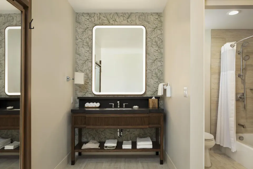 Accessible bathroom vanity and bathtub-shower at Hilton Waikoloa Village.