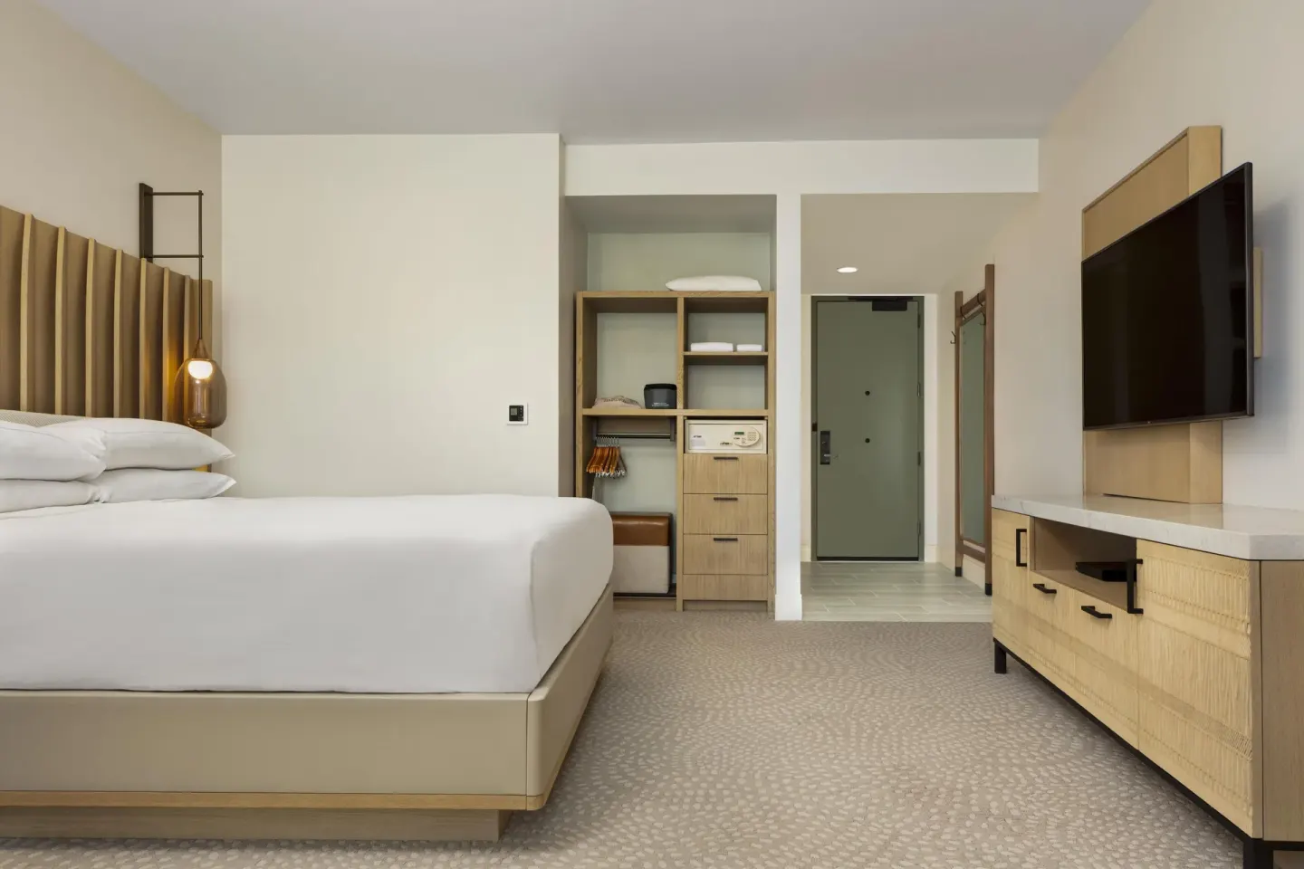 Accessible resort view king room entry and storage at Hilton Waikoloa Village.