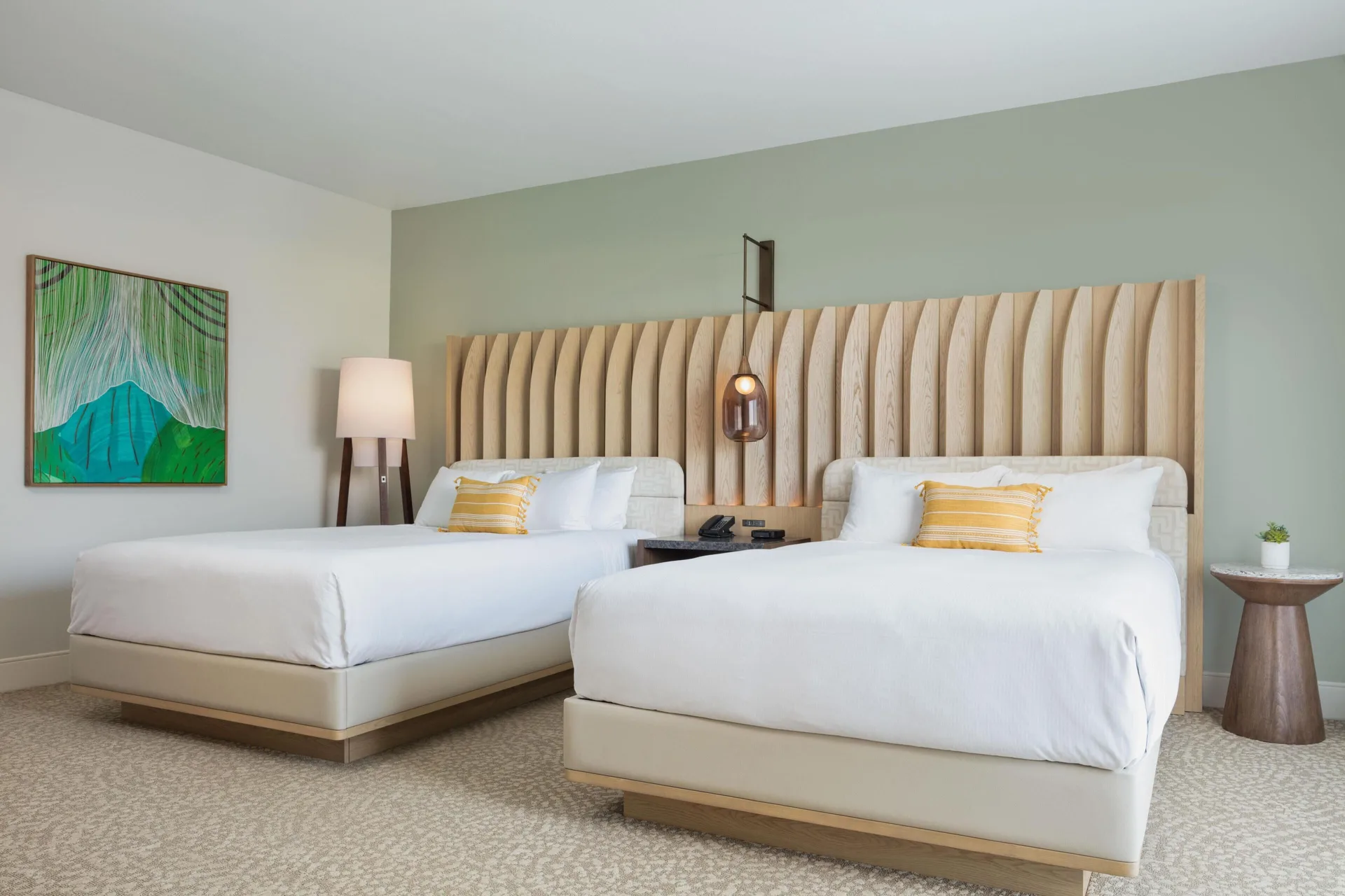 Two queen beds in a resort view accessible room at Hilton Waikoloa Village.