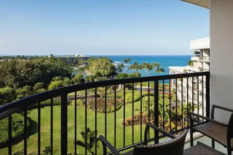 Ocean View Palace balcony with garden and ocean views at Hilton Waikoloa Village.
