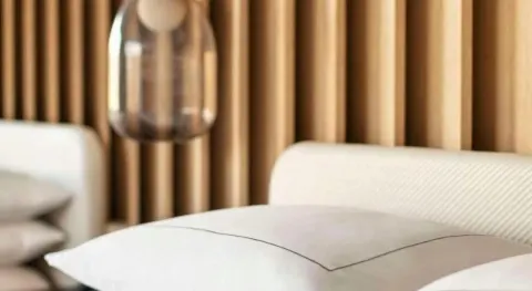 Close-up of the renovated Ocean View Palace bed and headboard at Hilton Waikoloa Village.