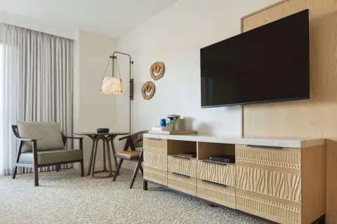 Renovated Ocean View Palace seating area and TV wall at Hilton Waikoloa Village.