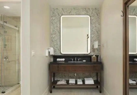 Renovated Ocean View Palace vanity and shower area at Hilton Waikoloa Village.