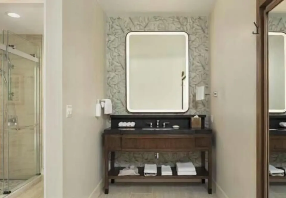 Renovated Ocean View Palace vanity and shower area at Hilton Waikoloa Village.