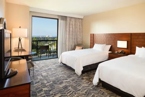 Two-bed resort view guest room with balcony at Hilton Waikoloa Village.