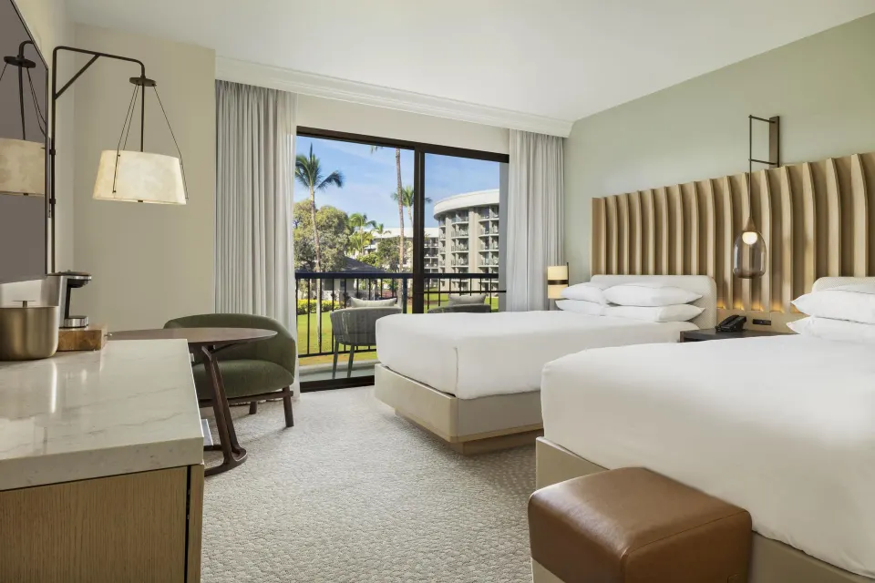 Resort view room with two queen beds and balcony at Hilton Waikoloa Village.