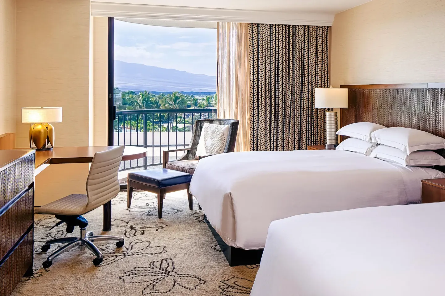 Two-bed resort view room with balcony and mountain view at Hilton Waikoloa Village.