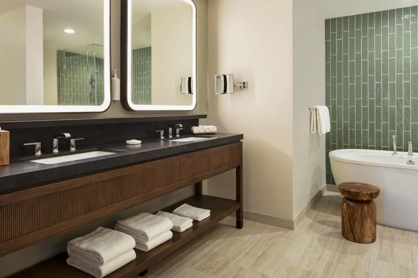 Royal Suite bathroom with double vanity and soaking tub at Hilton Waikoloa Village.