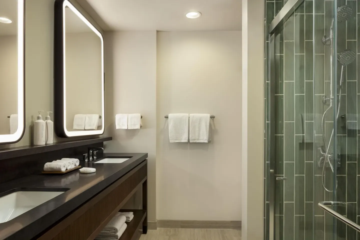 Accessible suite bathroom with double vanity and shower at Hilton Waikoloa Village.