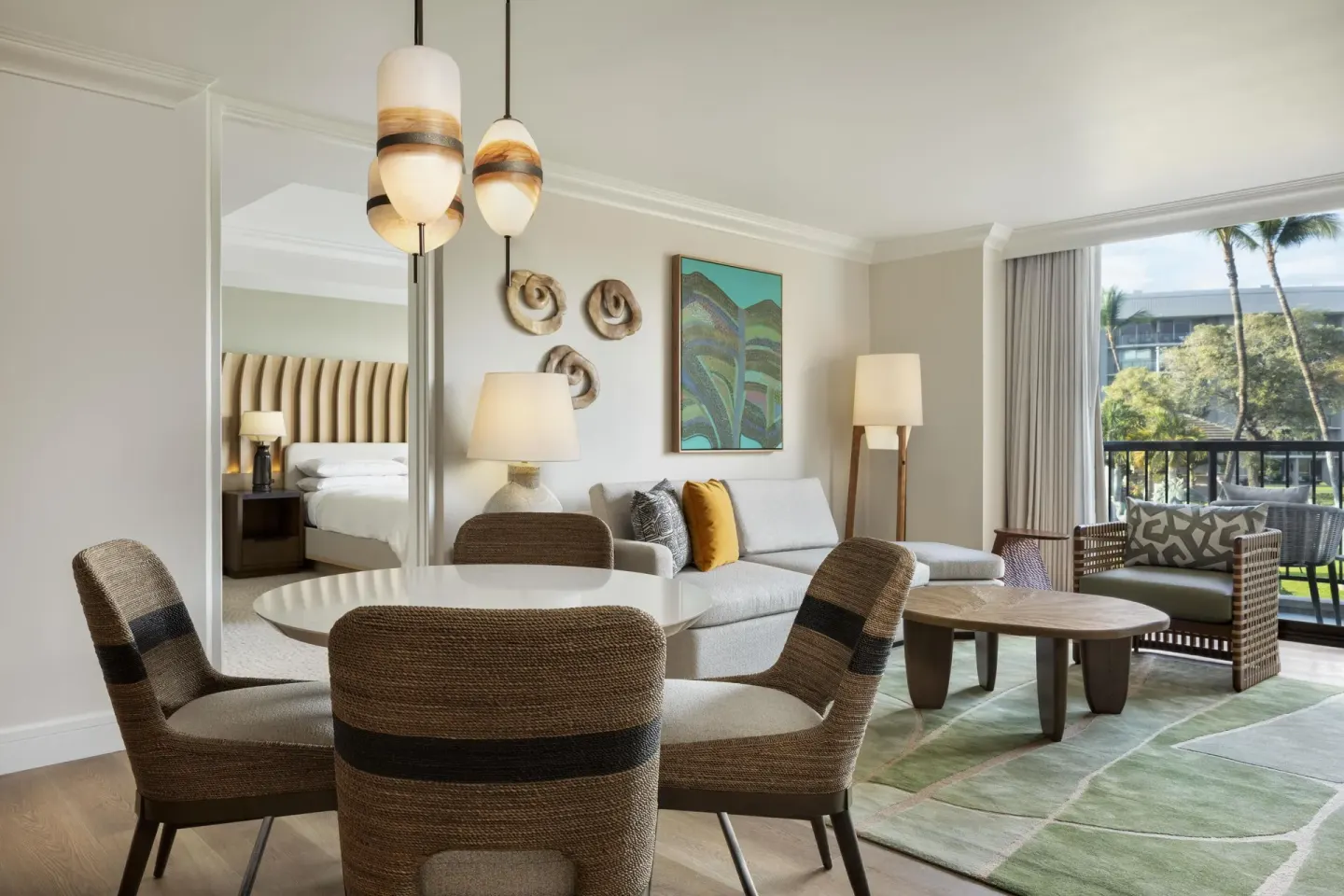 Accessible resort view suite living and dining area at Hilton Waikoloa Village.