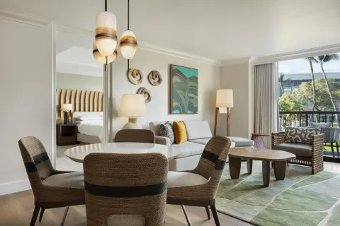 Accessible resort view suite living and dining area at Hilton Waikoloa Village.