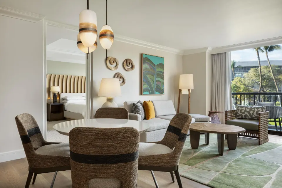 Accessible resort view suite living and dining area at Hilton Waikoloa Village.