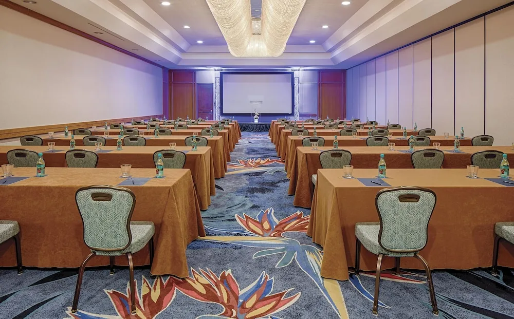 Classroom-style meeting room with projection screen at Hilton Waikoloa Village.