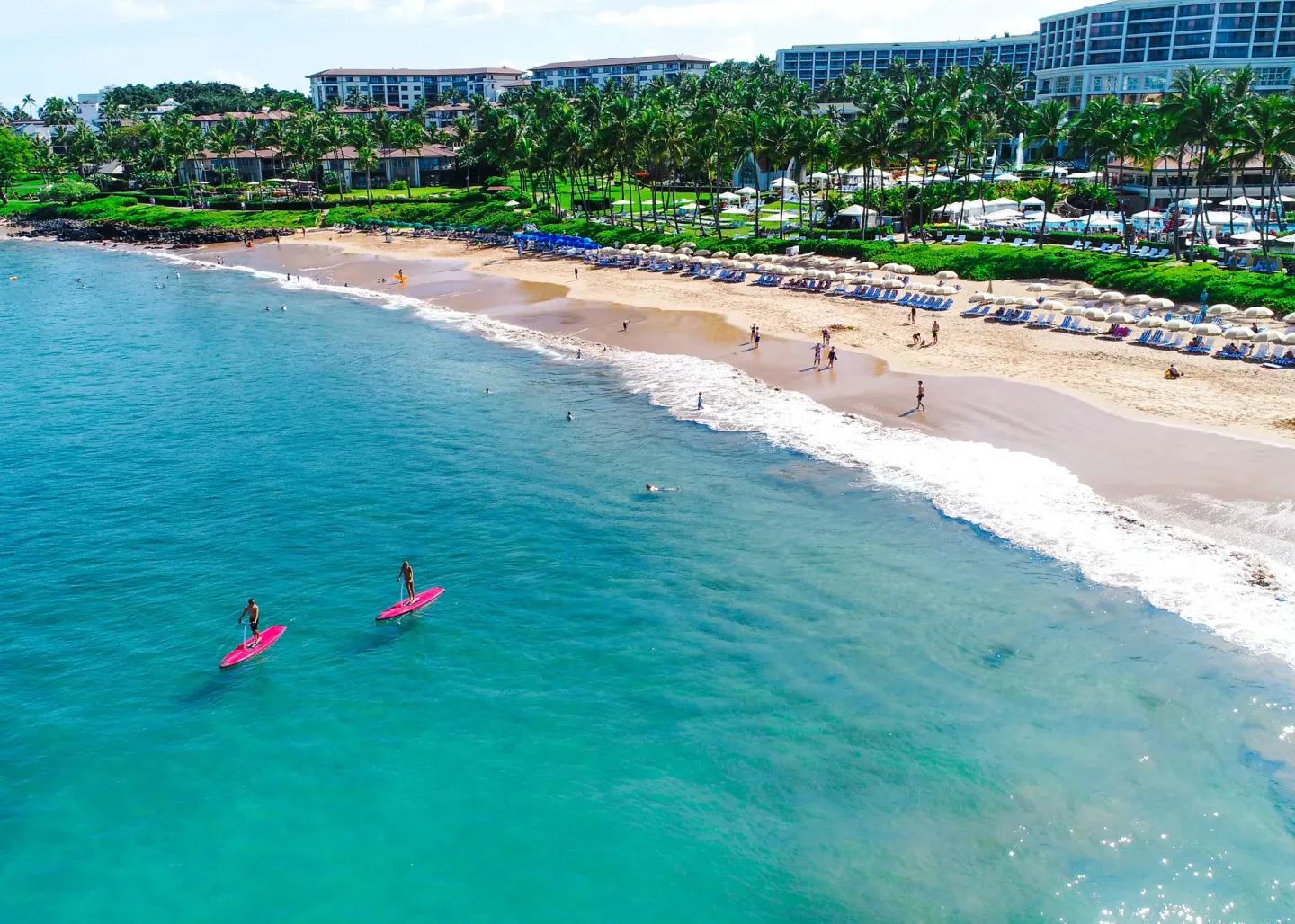 Aerial view of beach, turquoise water, and resort shoreline at Ho‘olei Villas at Grand Wailea.