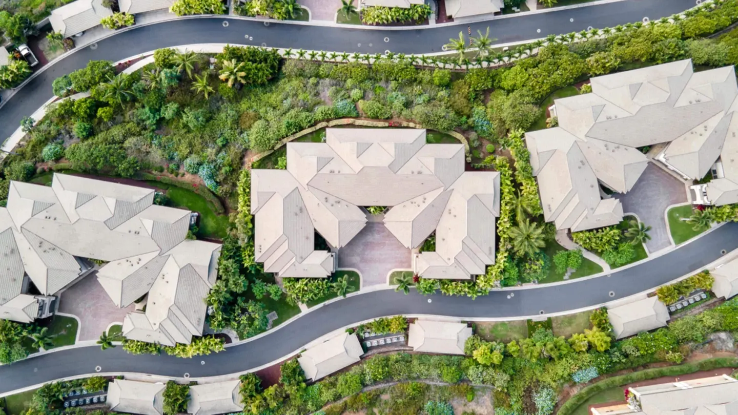 Aerial view of villa rooftops, roads, and landscaping at Ho‘olei Villas at Grand Wailea.