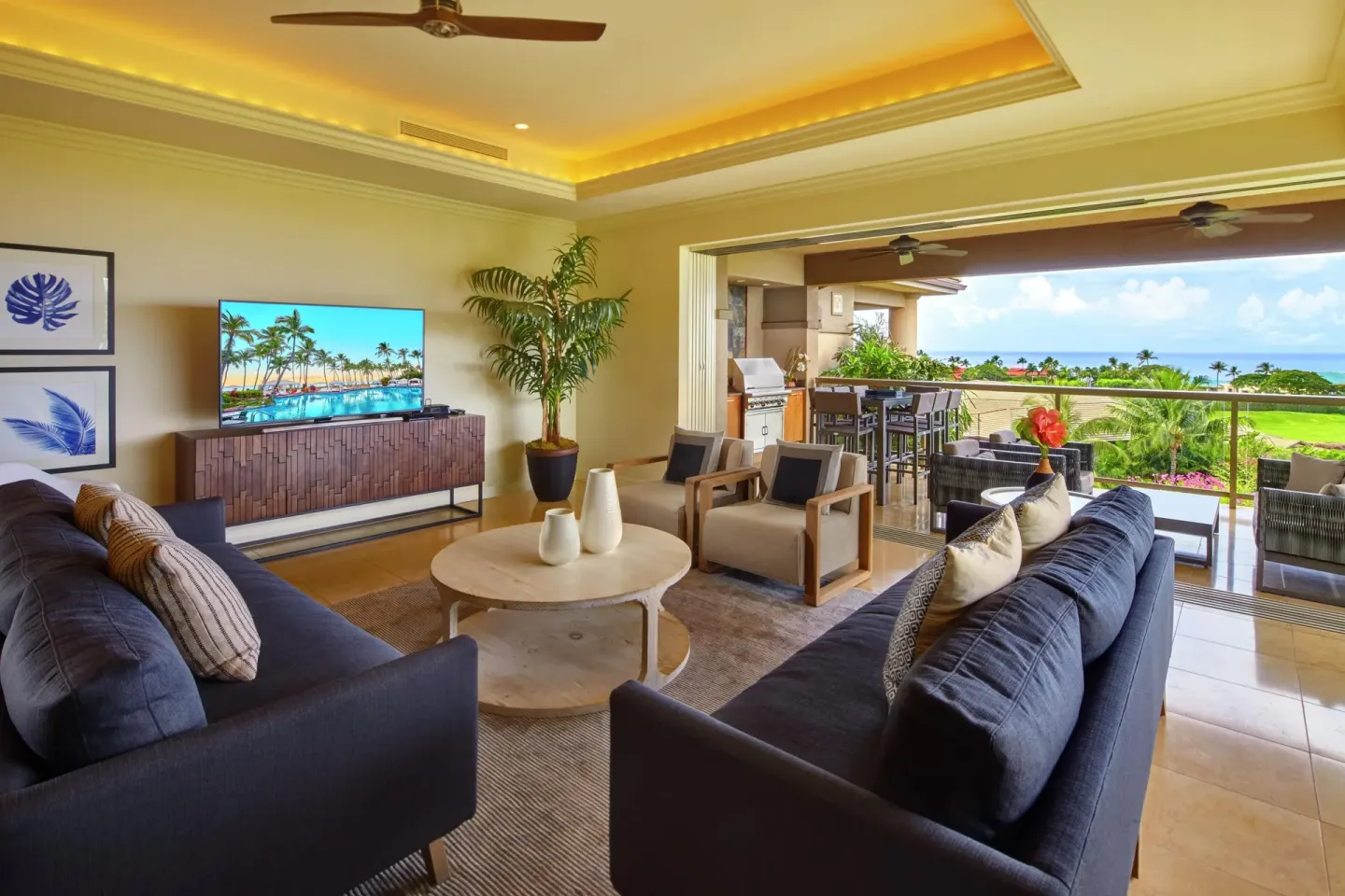 Open living room and lanai with ocean view at Ho‘olei Villas at Grand Wailea.