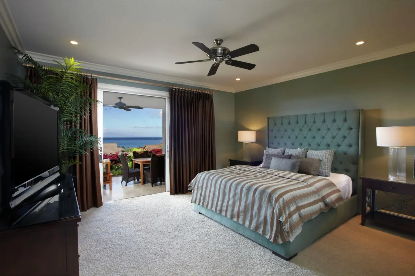 Ocean-view bedroom with king bed and lanai at Ho‘olei Villas at Grand Wailea.