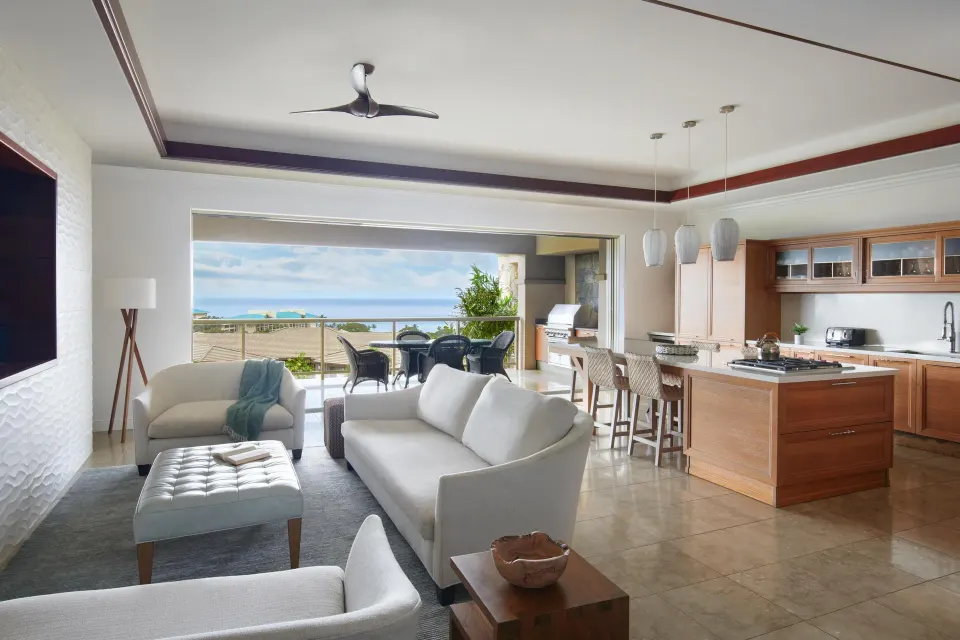 Open living room and kitchen with ocean-view lanai at Ho‘olei Villas at Grand Wailea.