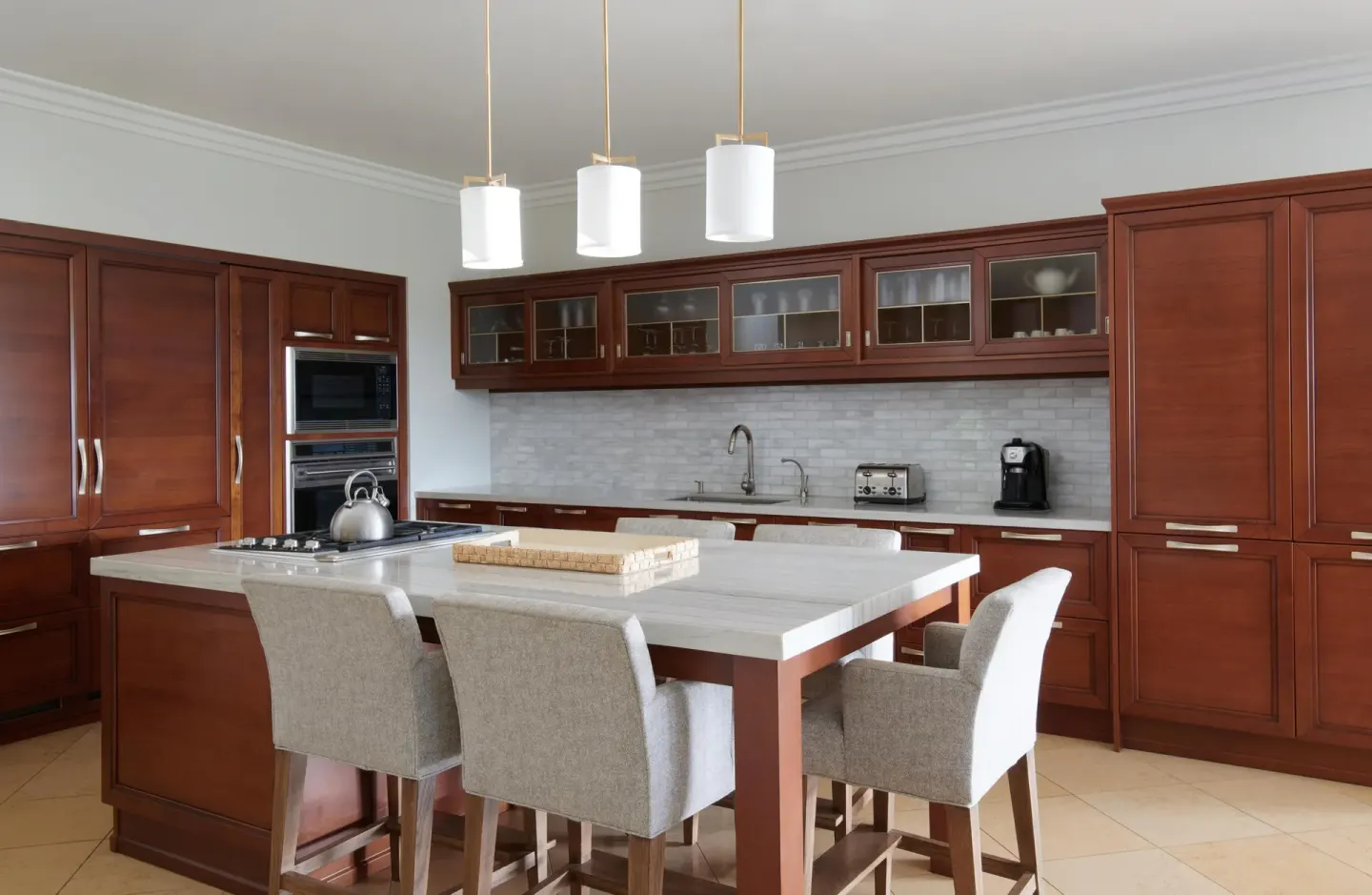 Full kitchen with island seating in a luxury villa at Ho‘olei Villas at Grand Wailea.