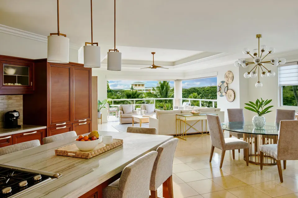 Open kitchen, dining, and living area in a luxury villa at Ho‘olei Villas at Grand Wailea.