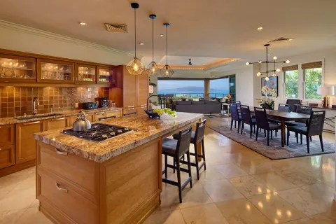 Three-bedroom ocean-view villa kitchen and dining area at Ho‘olei Villas at Grand Wailea.