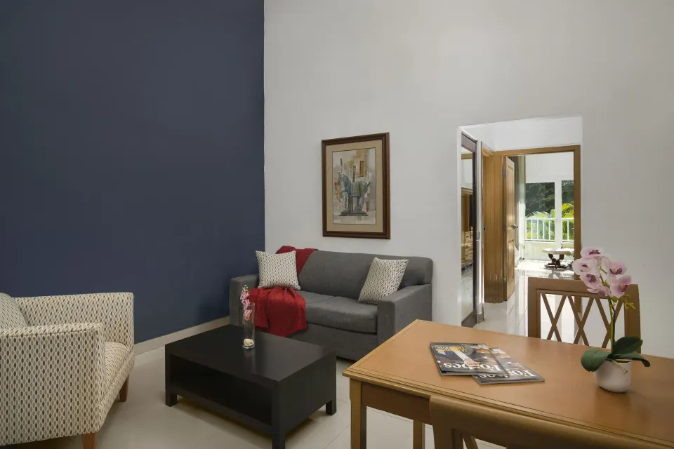 Royal Suite living and dining area at Hodelpa Garden Suites Golf & Convention Center.