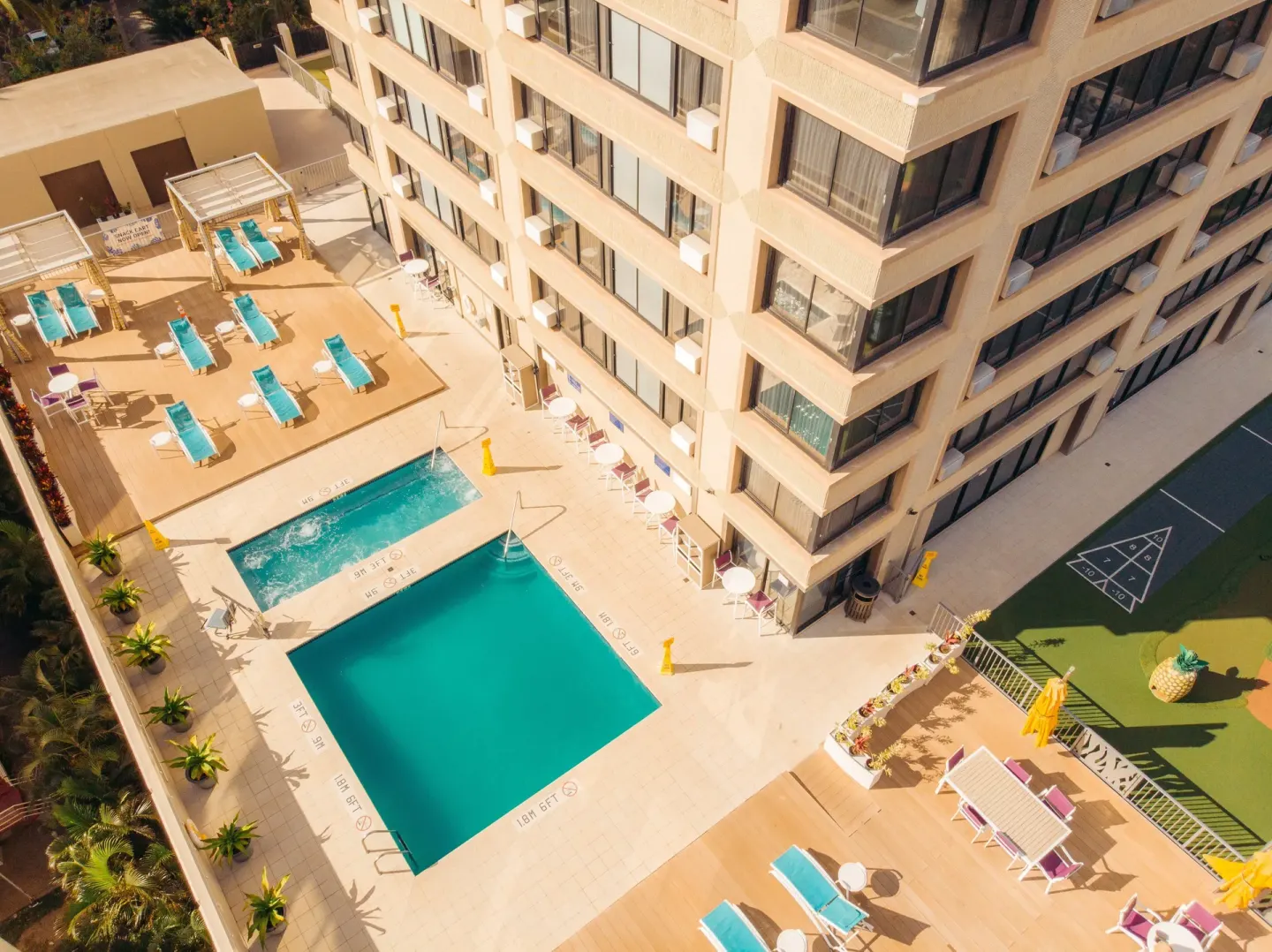 Aerial view of pool deck and game area at Holiday Inn Express Waikiki.