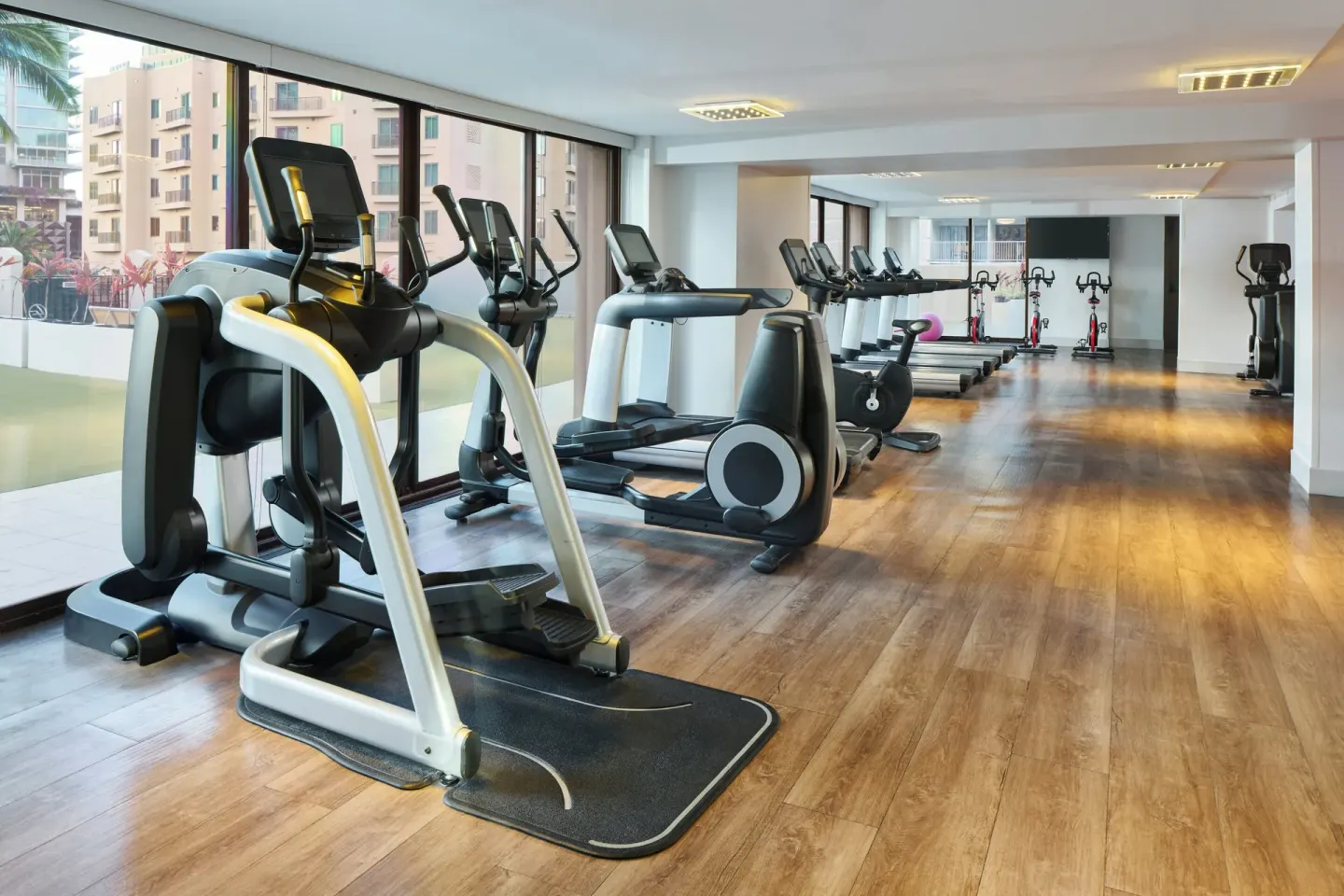 Fitness center with ellipticals, treadmills, and bikes at Holiday Inn Express Waikiki.
