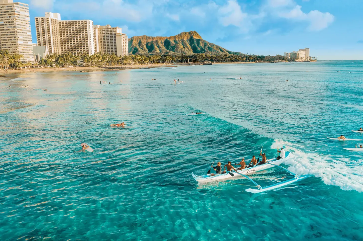 Outrigger canoe and swimmers off Waikiki Beach near Holiday Inn Express Waikiki.