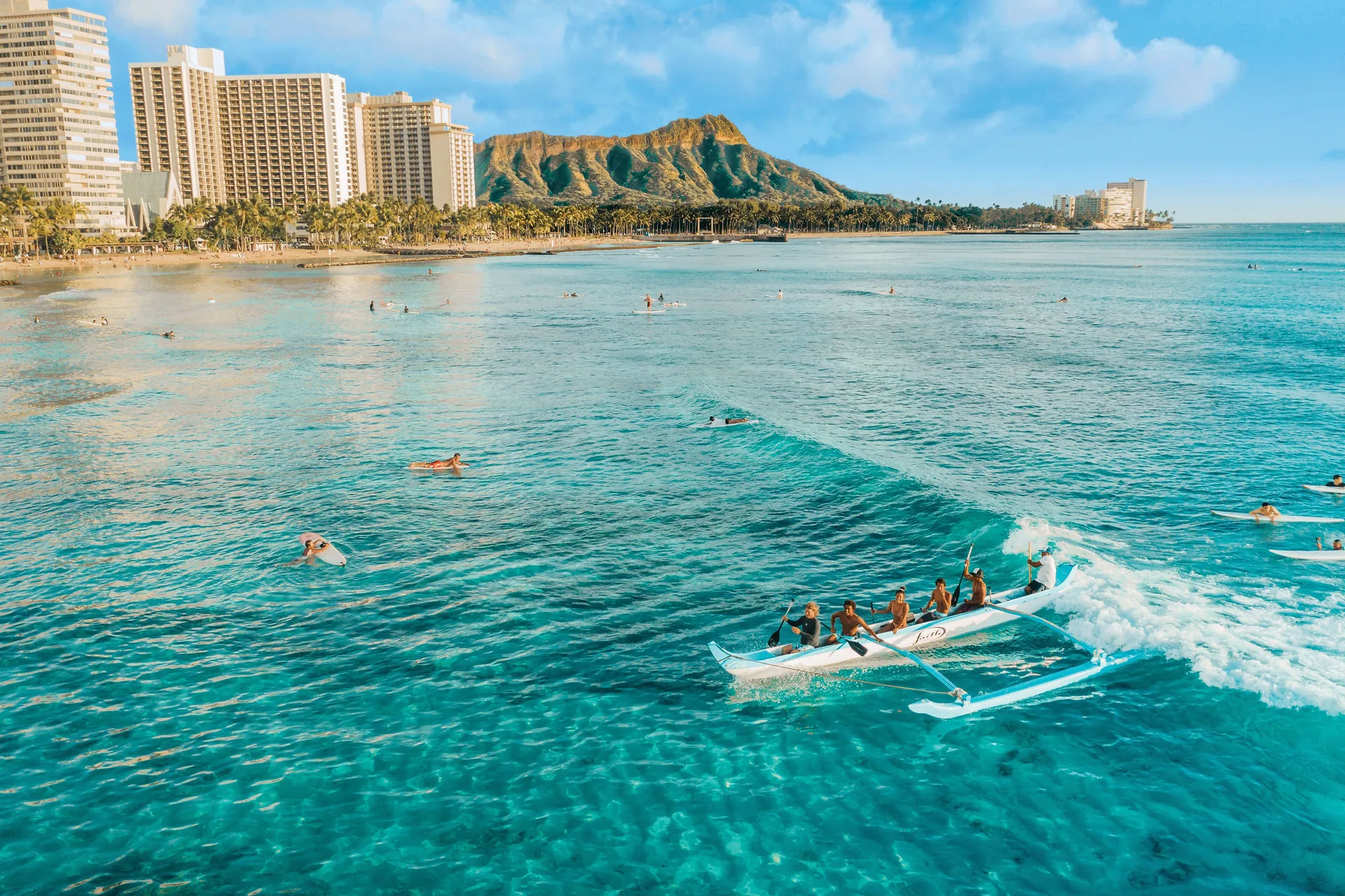 Outrigger canoe and swimmers off Waikiki Beach near Holiday Inn Express Waikiki.