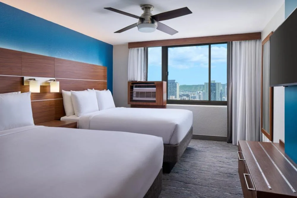 Accessible partial ocean view room with two beds at Holiday Inn Express Waikiki.