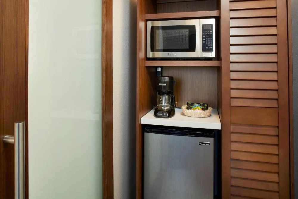 In-room microwave, coffee maker, and mini refrigerator at Holiday Inn Express Waikiki.