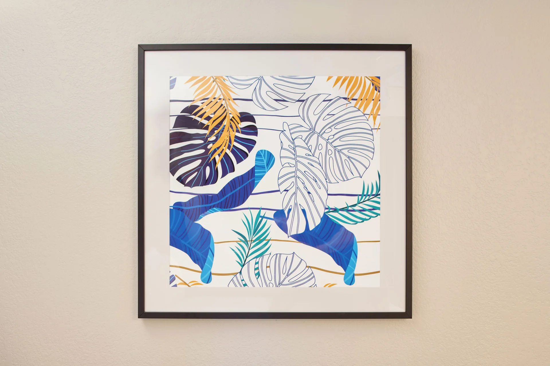 Framed tropical leaf artwork in an accessible standard room at Holiday Inn Express Waikiki.
