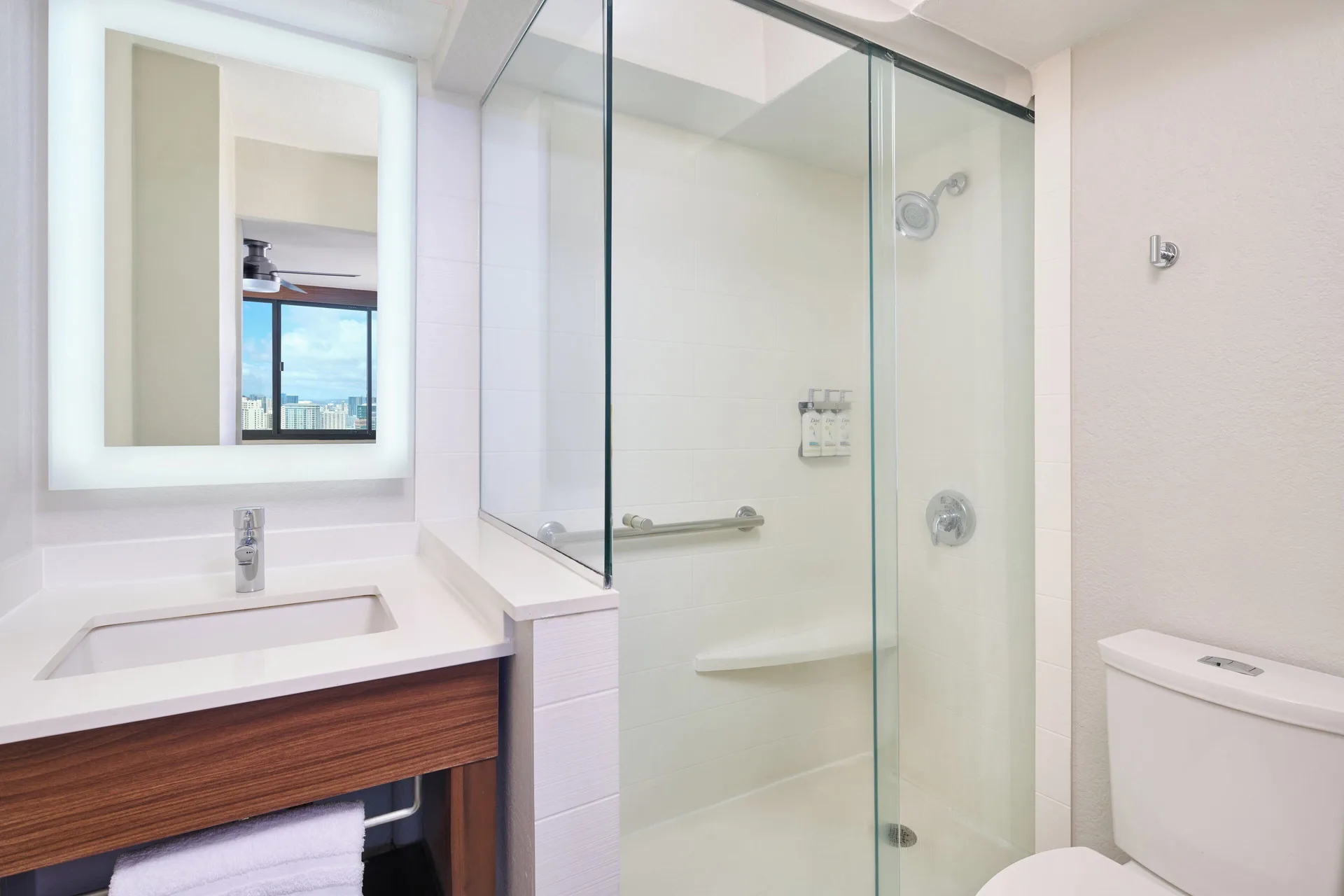Standard Room bathroom with walk-in shower and vanity at Holiday Inn Express Waikiki.