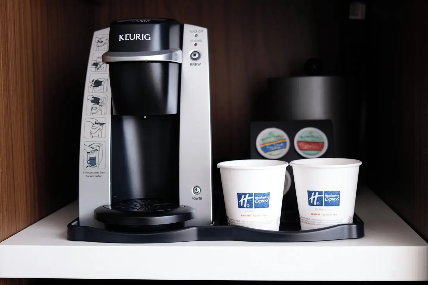 In-room coffee maker with cups in a Standard Room at Holiday Inn Express Waikiki.