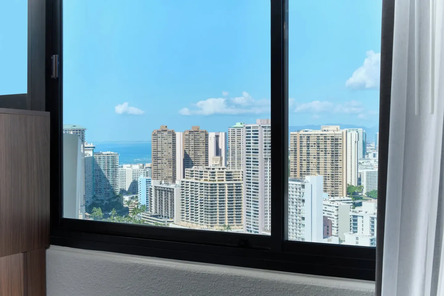 Partial ocean and Waikiki skyline view from a Standard Room at Holiday Inn Express Waikiki.