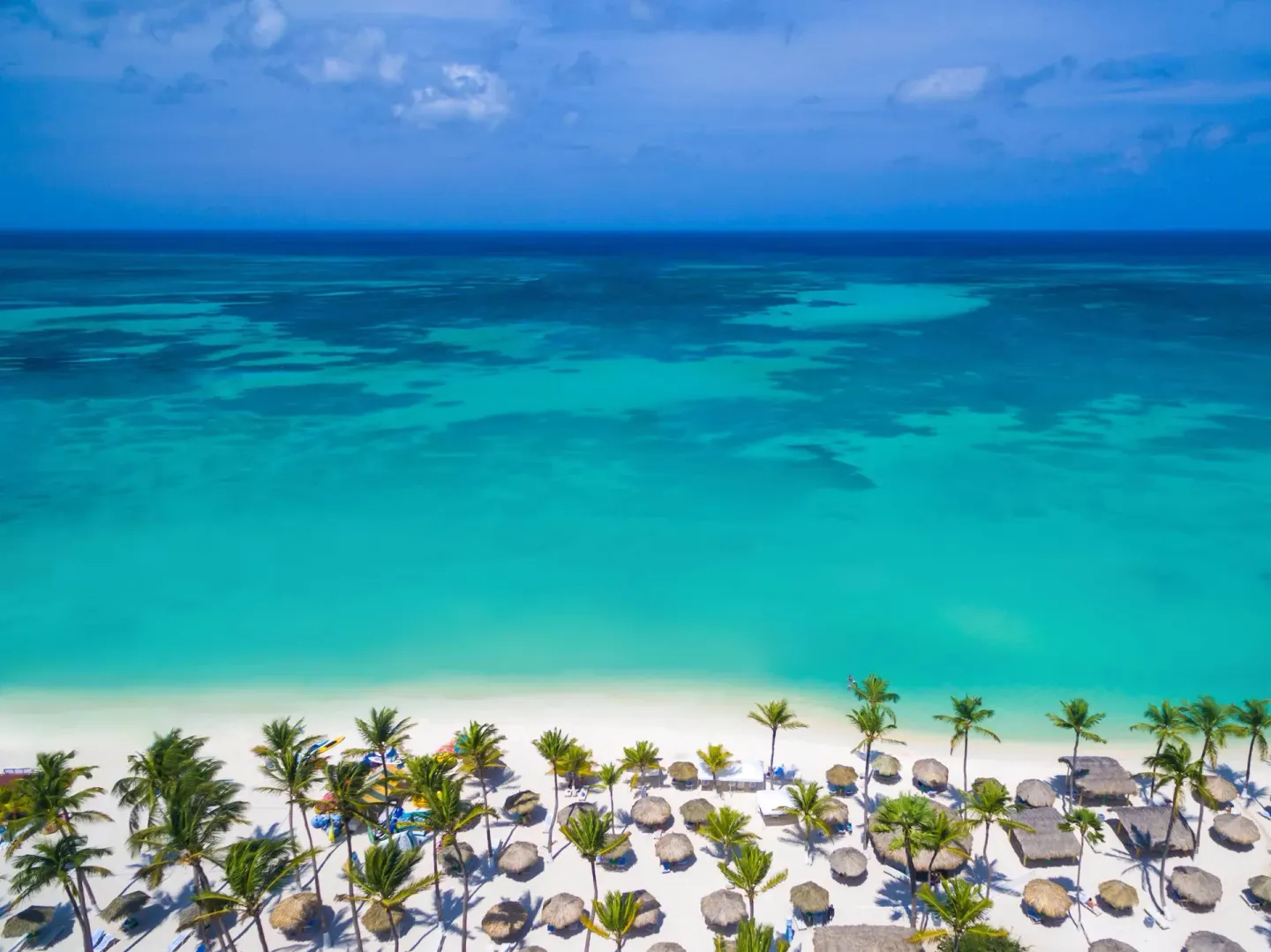 Aerial beach and turquoise ocean at Holiday Inn Resort Aruba - Beach Resort & Casino.